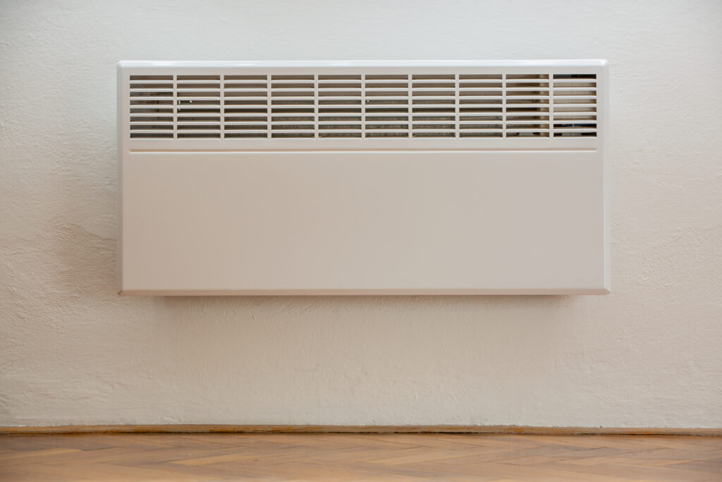 Electric panel heaters plugged into wall